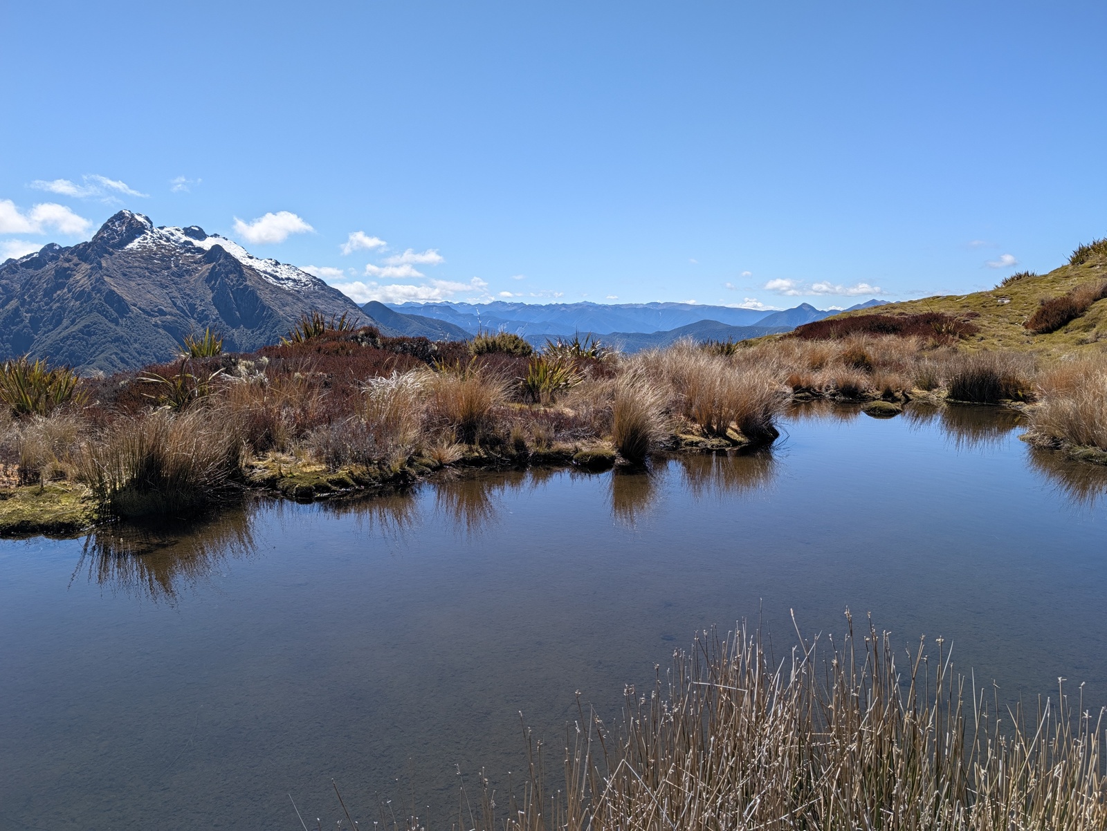 Great view from the tarn on Biggs Tops towards snow on Mt Kendall